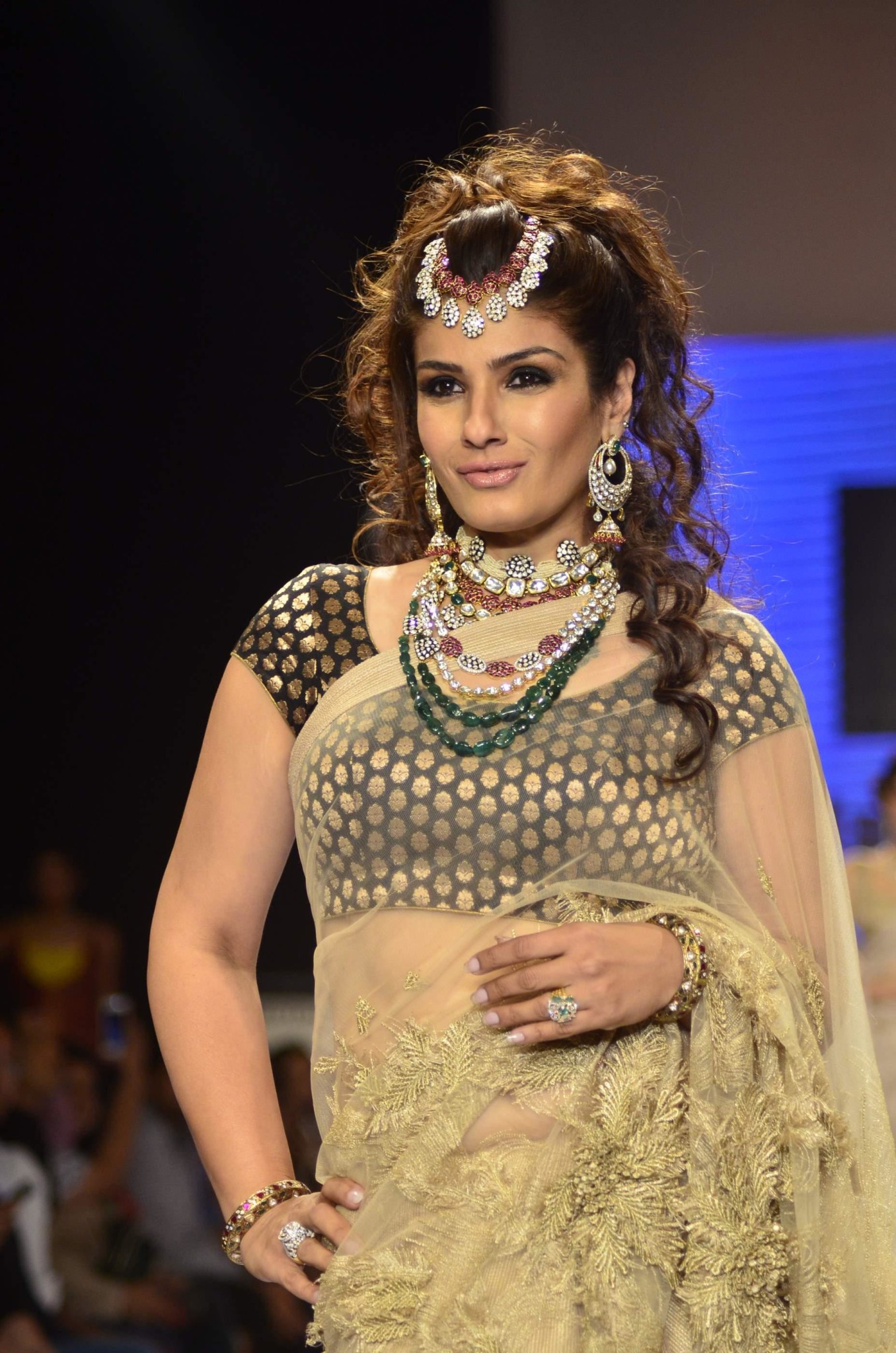 Actress Raveena Tondon walks the ramp displaying jewellery designed by Dipti Amisha during the India International Jewellery Week (IIJW) in Mumbai, on July 15, 2014. (Photo: IANS)