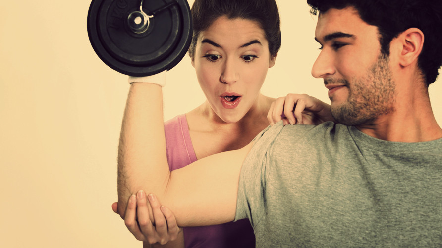 guy-lifting-dumbbell-woman-surprised