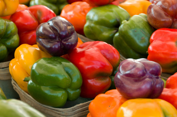 Multiple Colorful Fresh Bell Peppers in Baskets